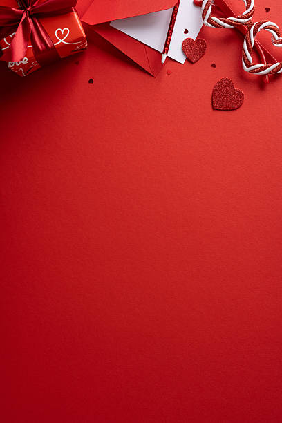 istock A vertical festive red Valentine scene featuring gift, envelope, heart, and glitter elements ready for a romantic greeting and celebration 2255071808