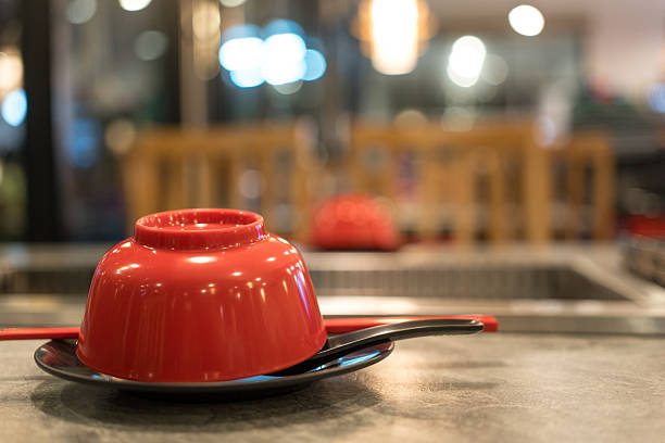 Red bowl for use in the restaurant for Shabu and sukiyaki or hotpot
