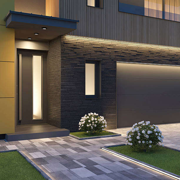 istock Modern Luxury Two-story Villa with garage and with Illuminated Pathway at Dusk 2255086058