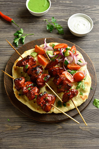 Tandoori skewers are marinated in spices, yogurt and lemon juice