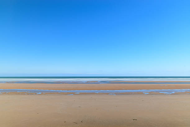 istock Expansive sandy Omaha Beach at low tide 2255086184