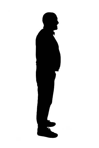 istock silhouette  side view of a standing and smiling man 2255086515
