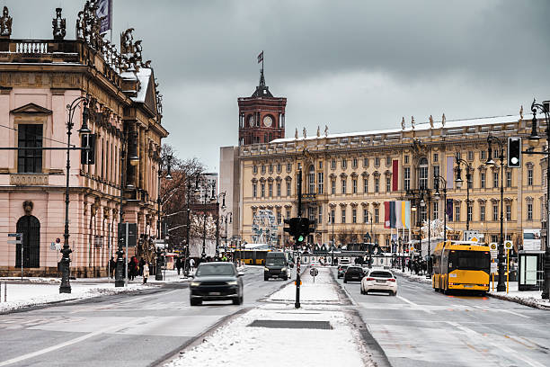 frozen streets unter den Linden in front of Berlin city palace and city hall in winter