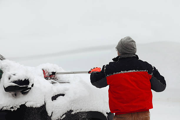 istock Man Removing Snow From Vehicle 2255090248