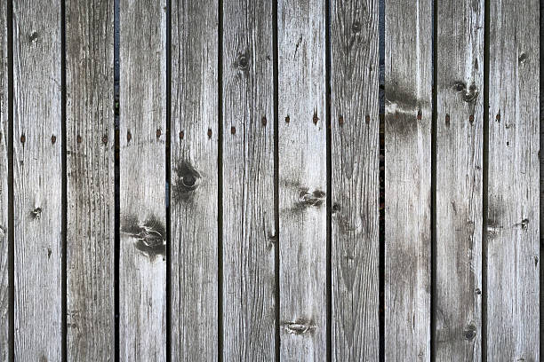istock Weathered Vertical Wood Plank Wall with Gray and Brown Tones 2255091988