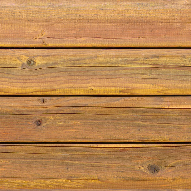 Horizontal oak wood planks in warm brown hues with visible grain, knots, and irregular edges create a rustic, handcrafted surface. The natural texture and slight variations in width evoke authenticity and warmth, ideal for interior design, carpentry references, or digital modeling of organic materials.