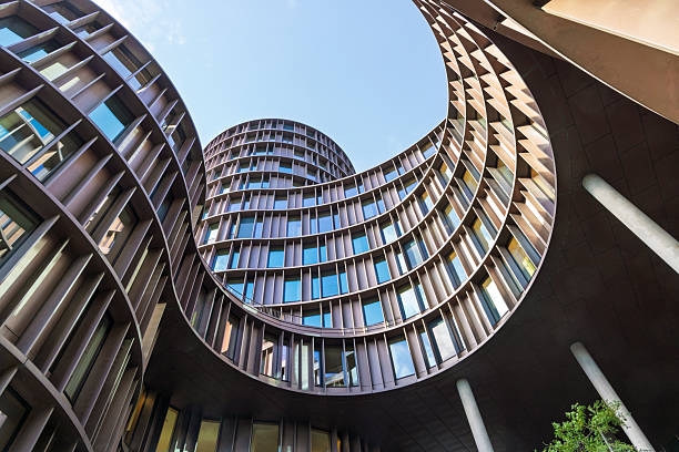 istock Curved office towers form a dramatic circular courtyard, showcasing modern architecture and reflective glass 2255094031