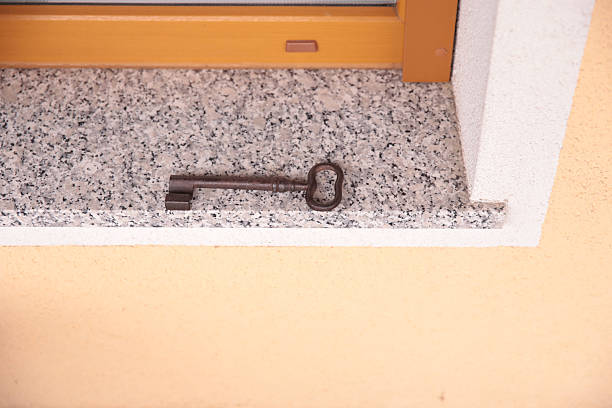 Antique iron key on granite window sill