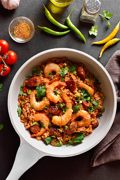 Creole jambalaya with prawn, smoked sausages and vegetables in c