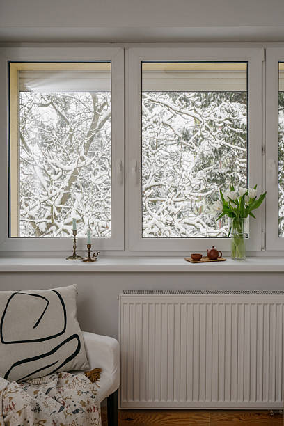 istock Winter view from indoor space with snow-covered trees outside 2255106694