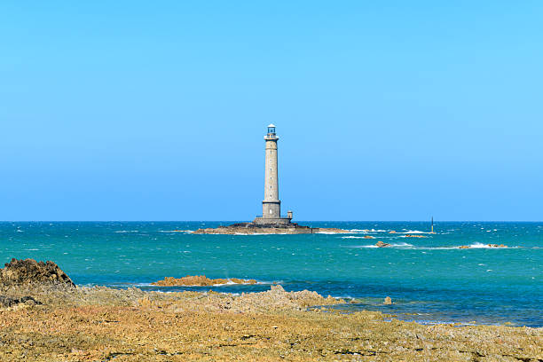 istock Lighthouse rising above tidal rocks, Cap de la Hague 2255117988