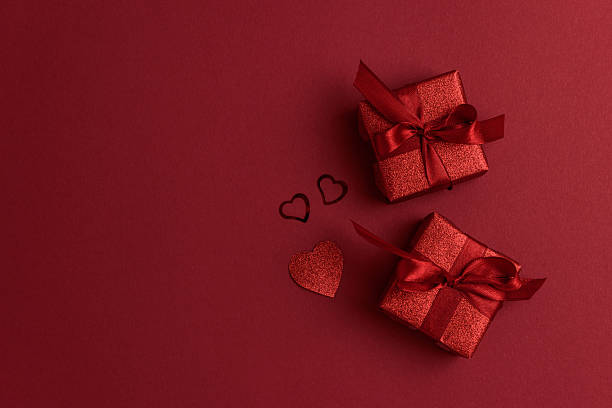 istock Red Glitter Gift Boxes and Hearts on Festive Background for Valentine's Day Celebration 2255118647