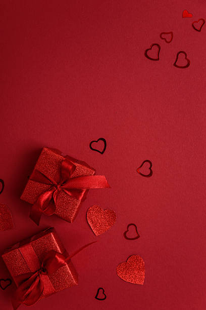 istock Red Glitter Gift Boxes and Hearts on Festive Background for Valentine's Day Celebration 2255118651