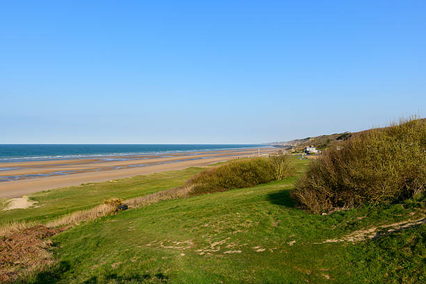 istock Open sandy shoreline and grassy dunes at Omaha Beach 2255126521