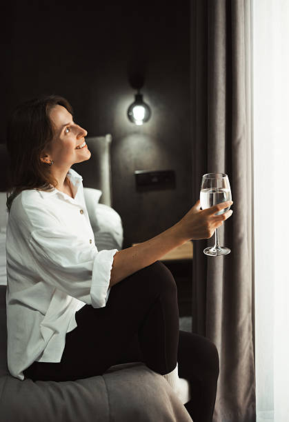 istock Woman resting in hotel room thinking 2255129689