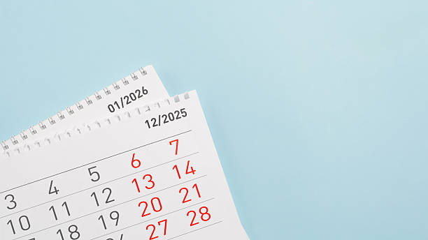 istock Minimal desk calendar pages displaying 2025 and 2026 on a light blue background 2255135115