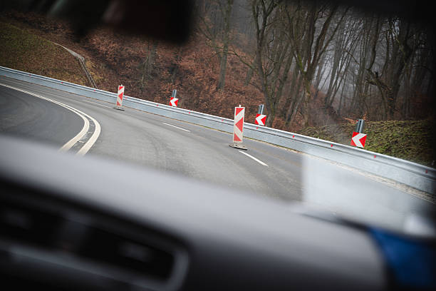 istock Curve on mountain road with warning signs 2255141119