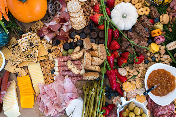 istock Large Charcuterie Grazing Table with various Meats, Crackers, Cheeses, Fruit, and Vegetables - Part of a Professional Catering Served as a Buffet for a Large Group 2255142417