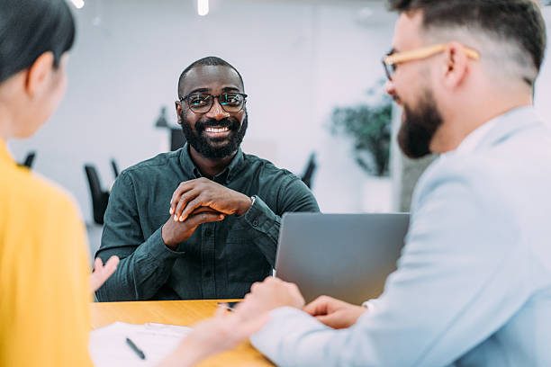 istock Group of business persons talking in the office. 2255145882