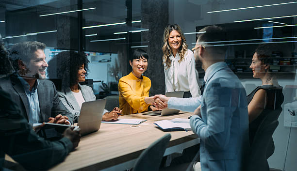 istock Businesspeople shaking hands across the table. 2255145915