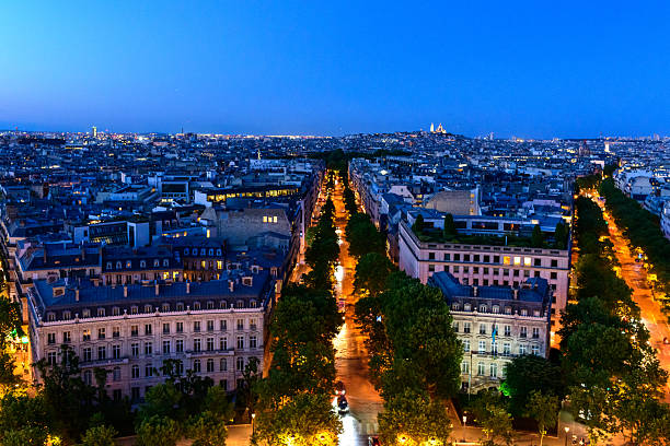 Paris avenues and Sacre Coeur at blue hour