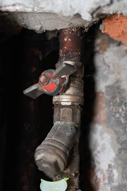 istock A close-up view of a water meter installed on an old plumbing pipe inside a utility cabinet. 2255149253