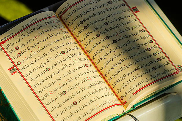 istock Sunlight reflecting on pages of the Quran 2255154576