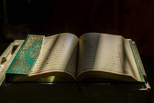 istock Sunlight reflecting on pages of the Quran 2255154610