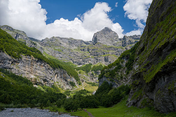 istock Majestic limestone peaks above lush alpine valley 2255156310