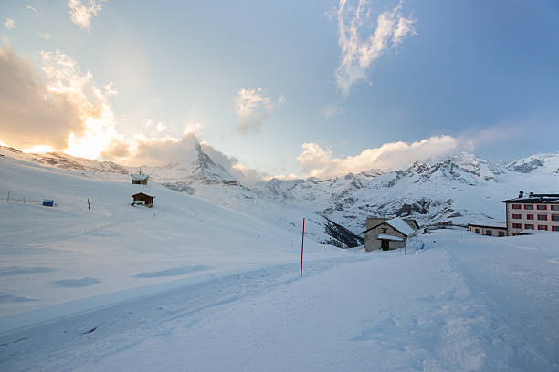 The beautiful colours of sunset wash over the Matterhorn and surrounding slopes