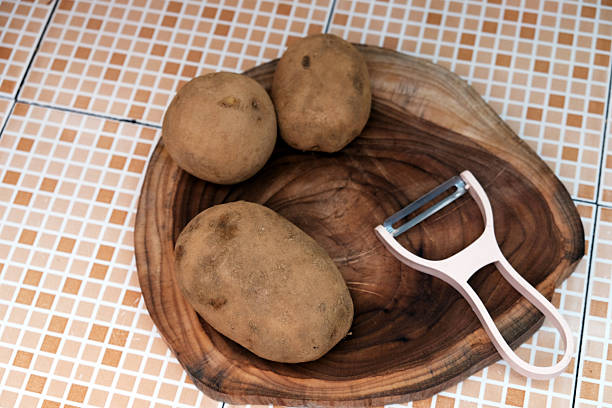 Cutting potatoes, cutting board, kitchen knife, hands, close up, raw potato, cooking, homemade food