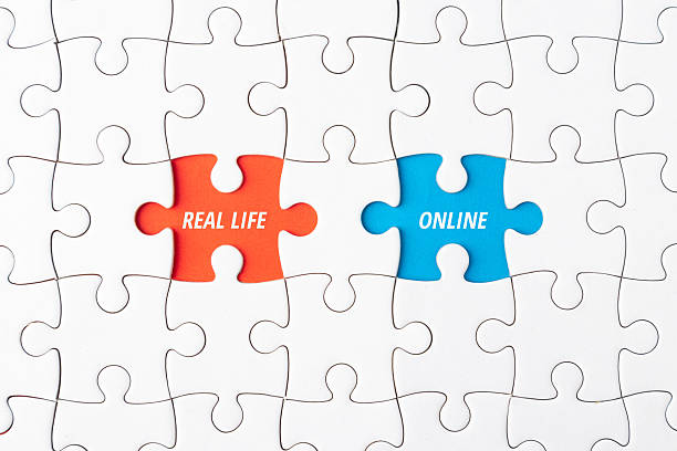 istock White jigsaw puzzle with missing pieces revealing REAL LIFE and ONLINE text, representing the digital detox concept, internet usage balance, mental wellbeing, and screen time management 2255176732