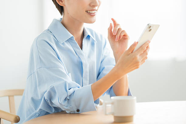 istock A Japanese woman in her 30s using a smartphone at home 2255180374