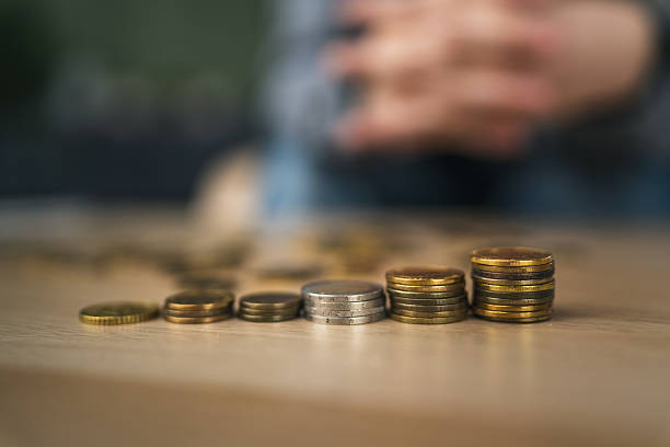 istock Coins in increasing stacks illustrating financial growth and savings 2255183102