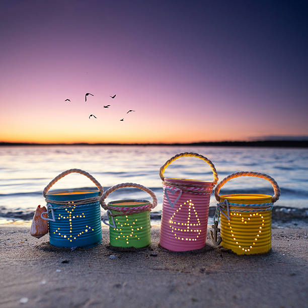 istock Colorful DIY Can Lights with Maritime Motifs Illuminating a Summer Beach 2255184962