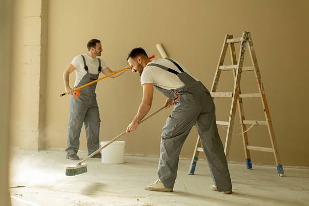 istock Two men painting an interior wall during home renovation work 2255190692