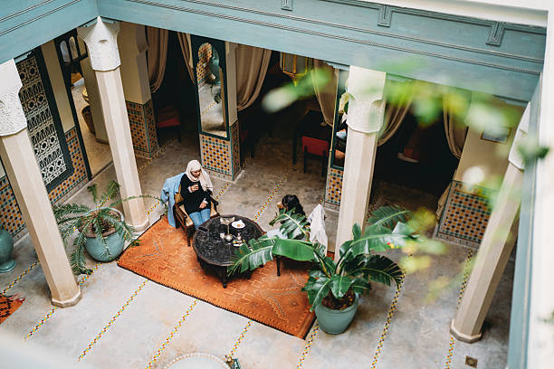 istock Women enjoying tea in Moroccan riad courtyard 2255193867
