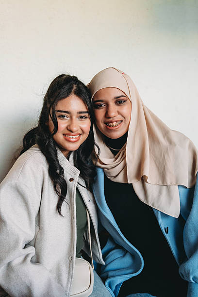 istock Two young diverse friends smiling together 2255196259