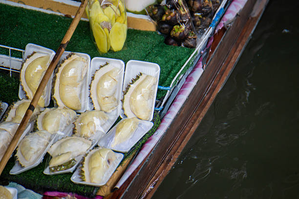 Damnoen Saduak Floating Market. Boats loaded  with fresh fruits and vegetables.