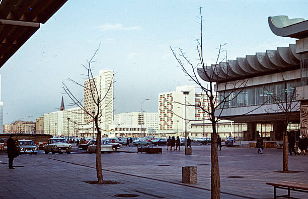 Historical photograph from April 1973: Alexanderplatz in Berlin, Germany, during the GDR era, featuring the House of Travel and the Forum Hotel.