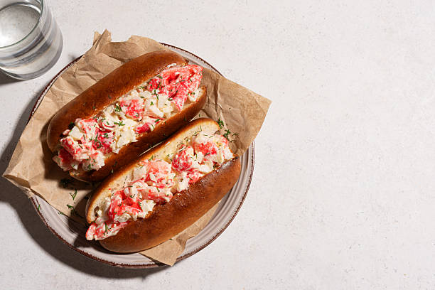 Lobster Roll. Traditional classic American Sandwich. New England classic meal. Fresh Maine Lobster with mayo and celery served in toasted  roll. Top view, copy space.