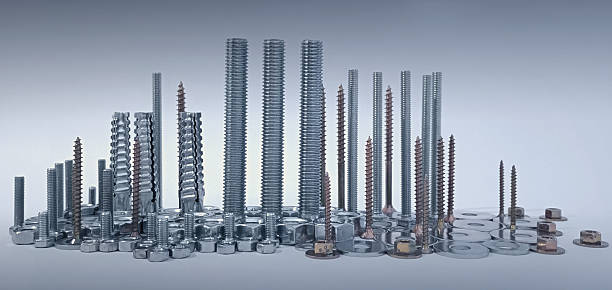 Bolts and nuts composed as a city with mechanical skyscrapers, financial district and infrastructure. Skyline panorama. Closed composition, twilight cloudy mood.