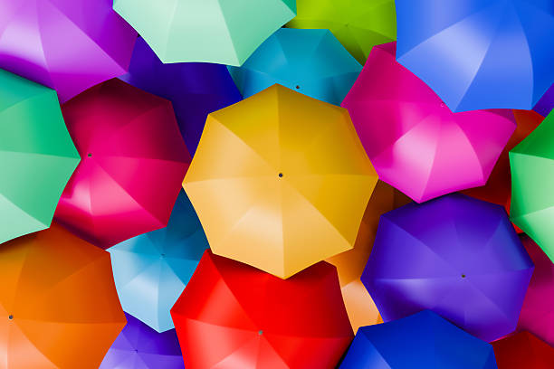 istock Yellow Umbrella Among Colorful Umbrellas 2255208402