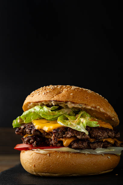 One smash burger on black background