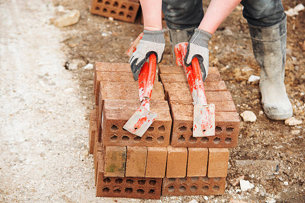A worker carrying wood