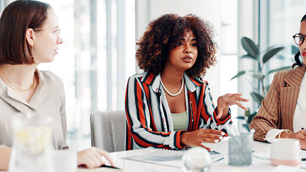 istock Creative agency, meeting or people in boardroom for discussion, campaign schedule or release date choice. Teamwork, suggestion or women with idea for launch agenda, brand awareness or plan promotion 2255214299