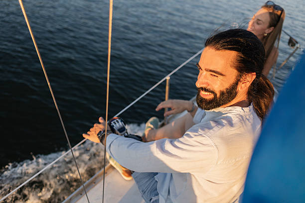 istock Happy couple enjoying sailing boat on ocean 2255216395