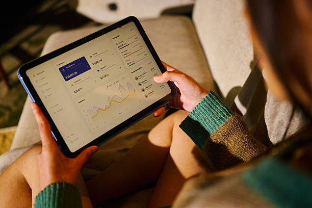 istock Young woman viewing personal finance data on tablet 2255217310