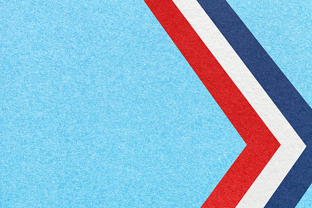 Sky textured paper background with red, white, blue arrow shapes and copy space. Abstract geometric banner.