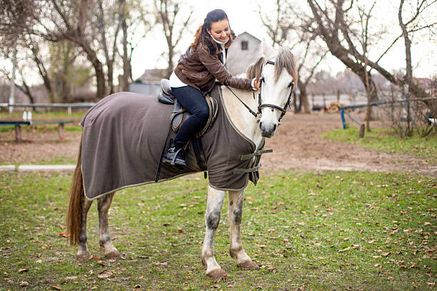 Friends Riding Horses At Park